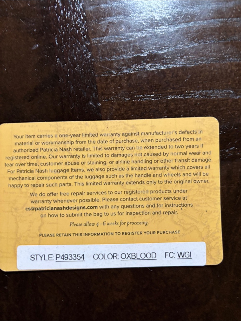 Patricia Nash Oxblood Leather Warranty Tag - Yellow Backing